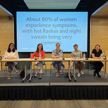 Kelly Jimenez, Mel Hoffman, Dr. Michele Bennett, Jan Morey and Dr. Pam Huerter sit behind a table