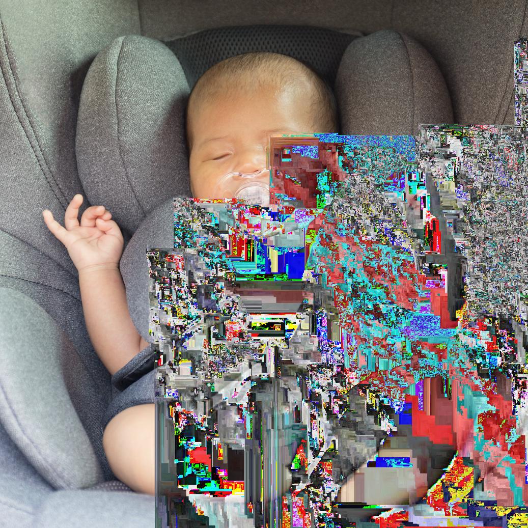 Newborn baby in a car seat