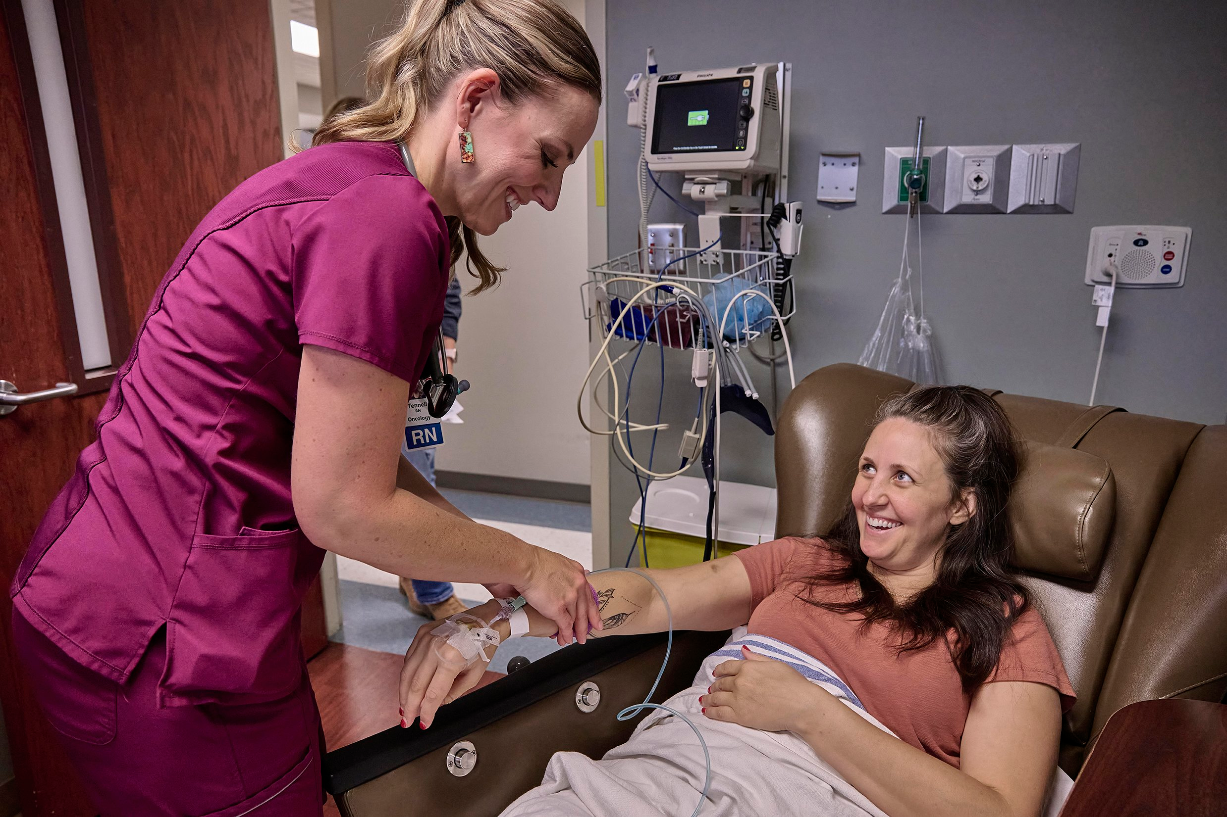 Tenneil Noll, RN, treats a Cancer Center patient